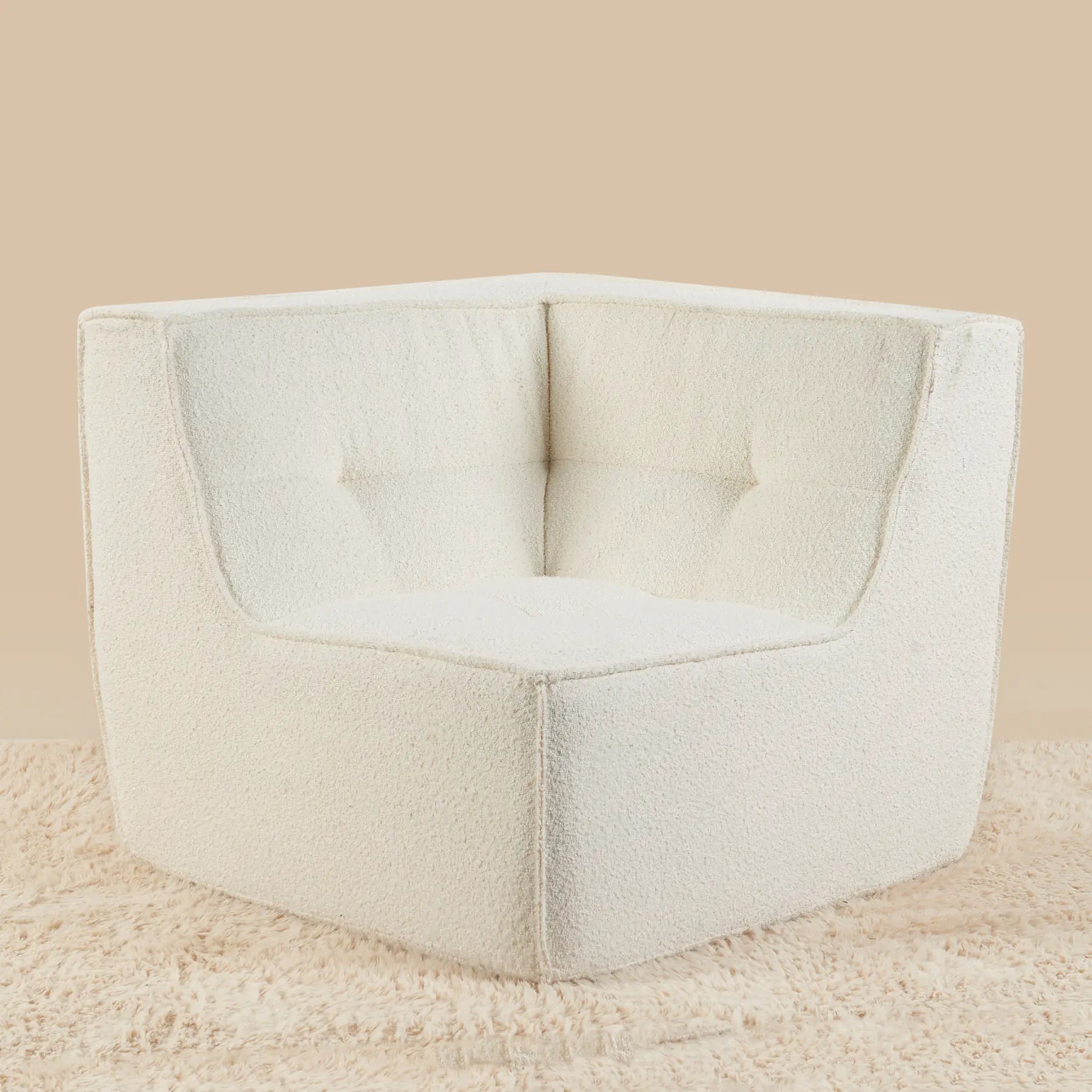Beige corner chair on a beige background [color: ivory-boucle]