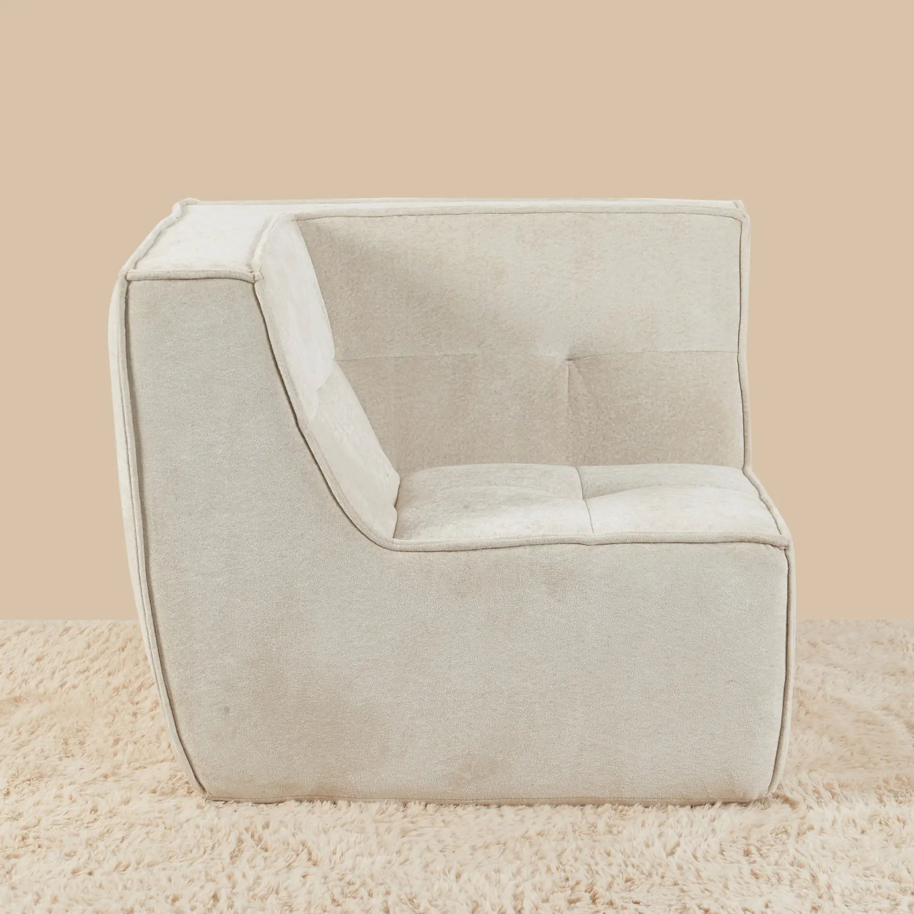 Beige armchair on a beige carpet with a beige wall background [color: oat-snow-velvet]