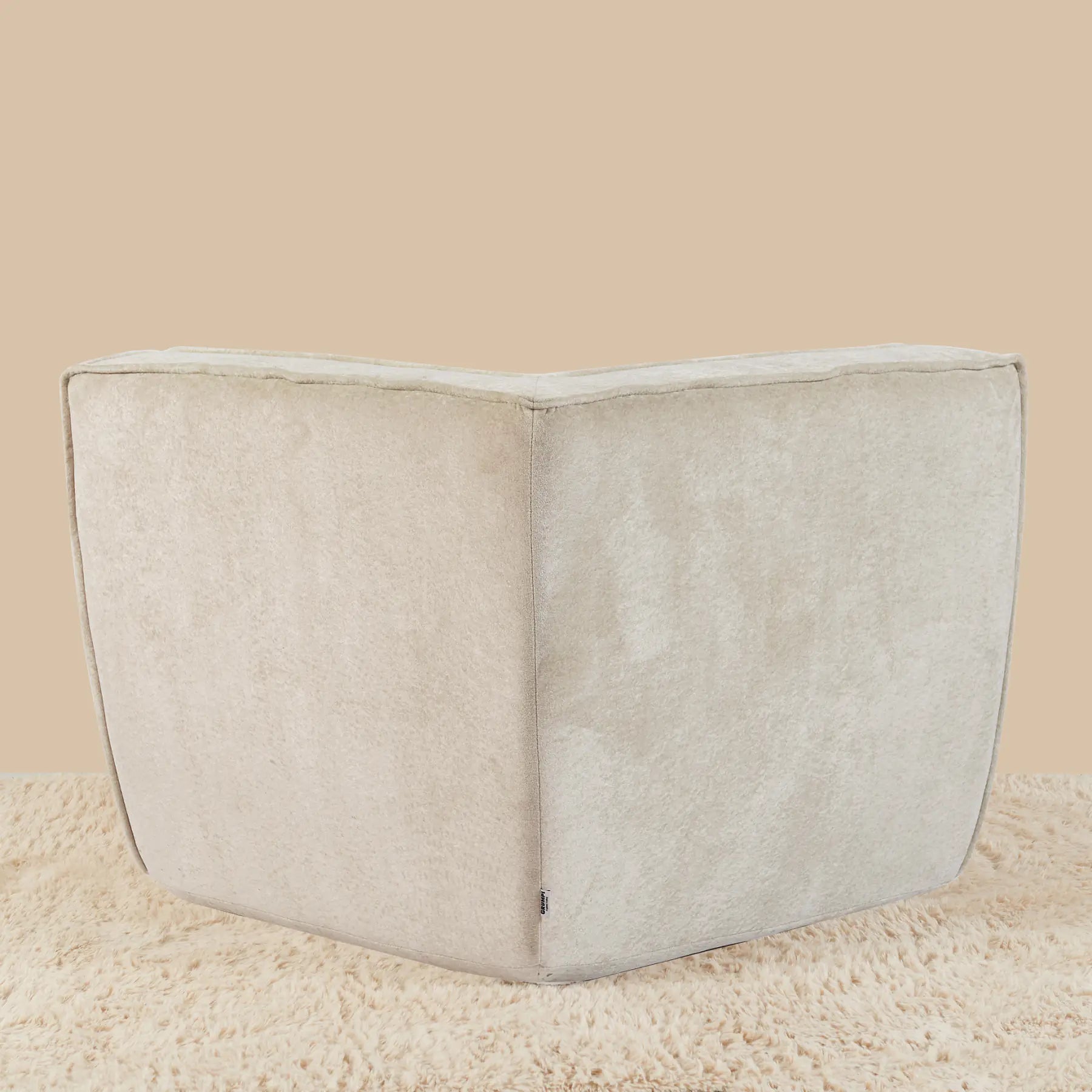 Beige corner cushion on a beige background [color: oat-snow-velvet]