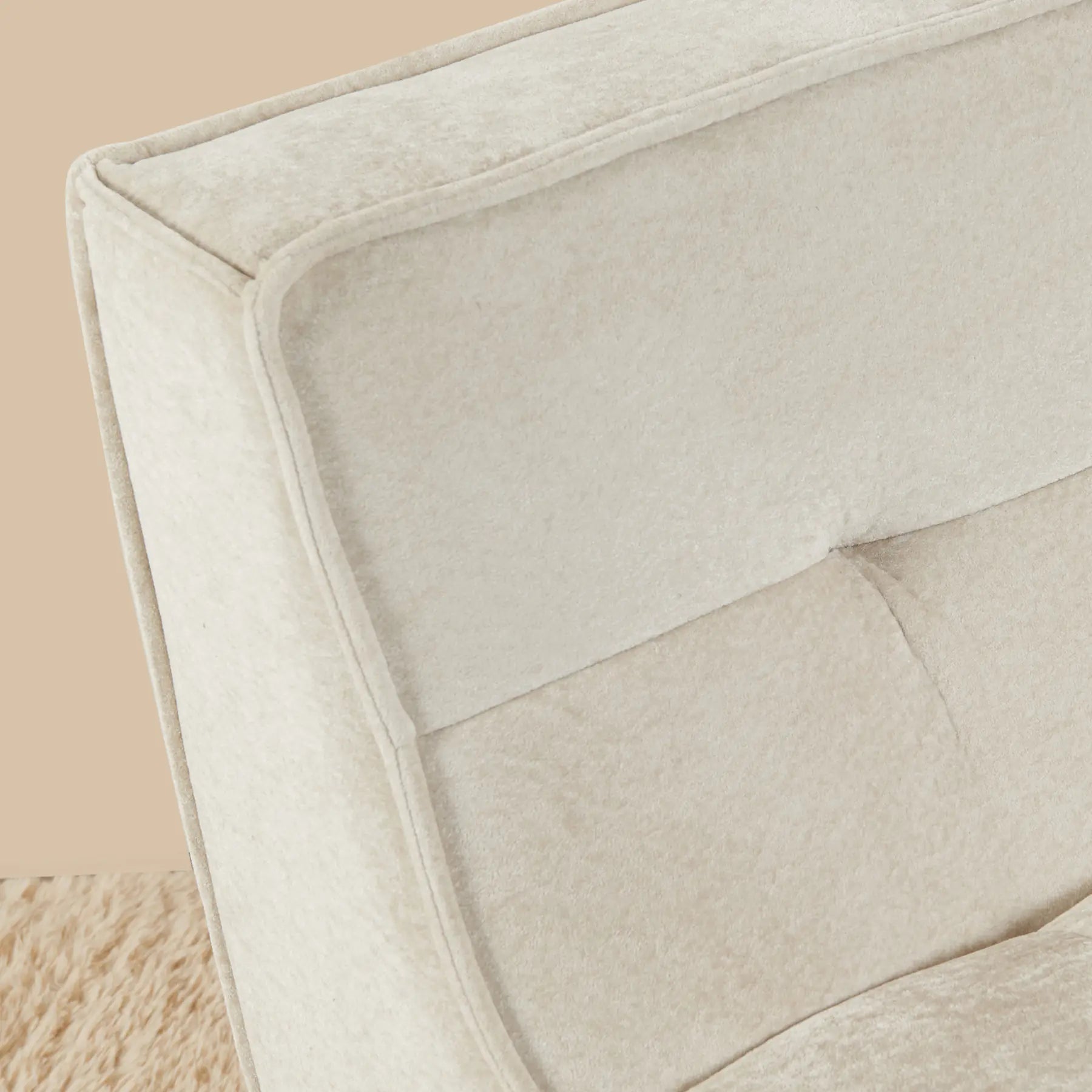 Close-up of a beige textured cushion on a soft beige background [color: oat-snow-velvet]