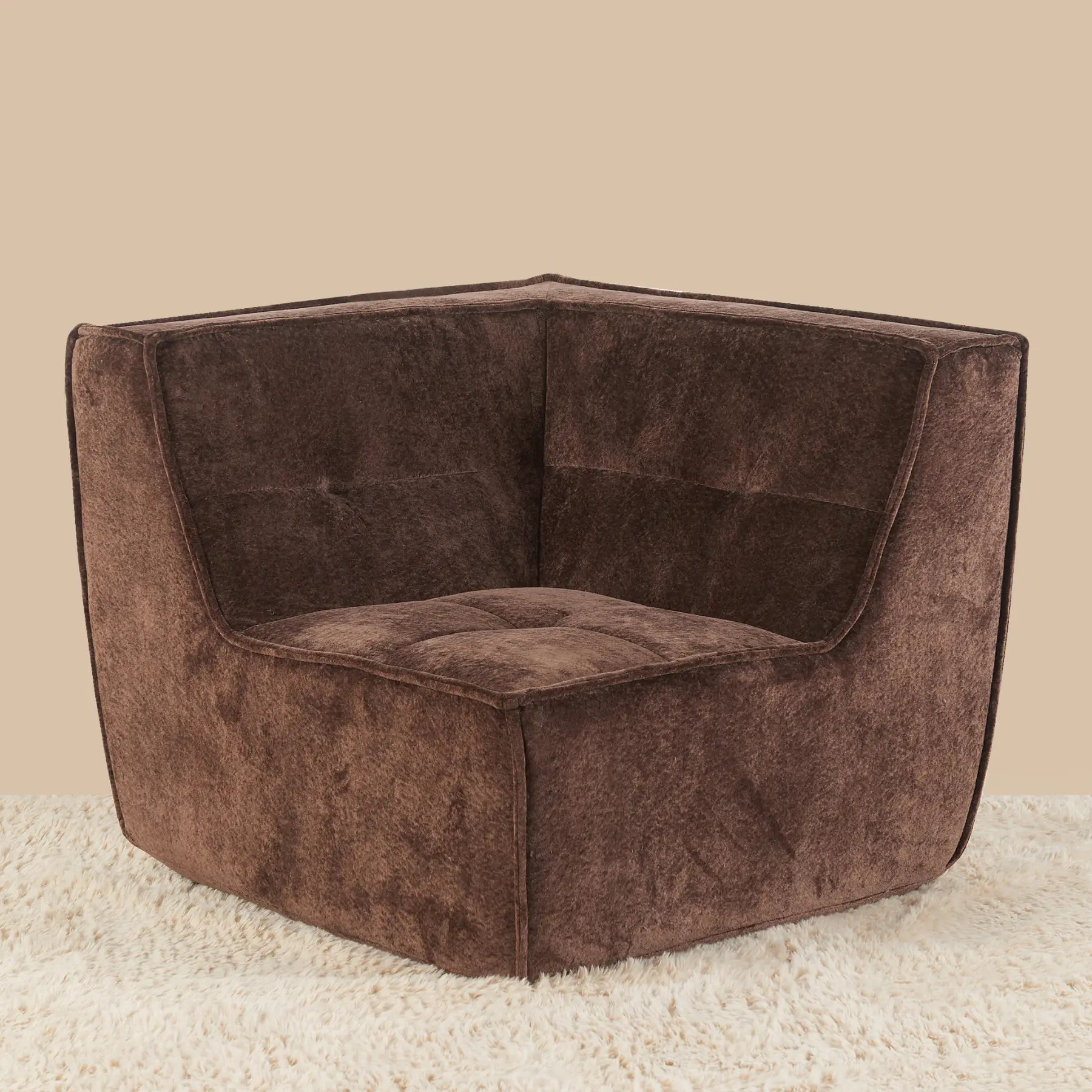 Brown textured corner chair on a beige carpet with a beige wall background [color: brown-snow-velvet]