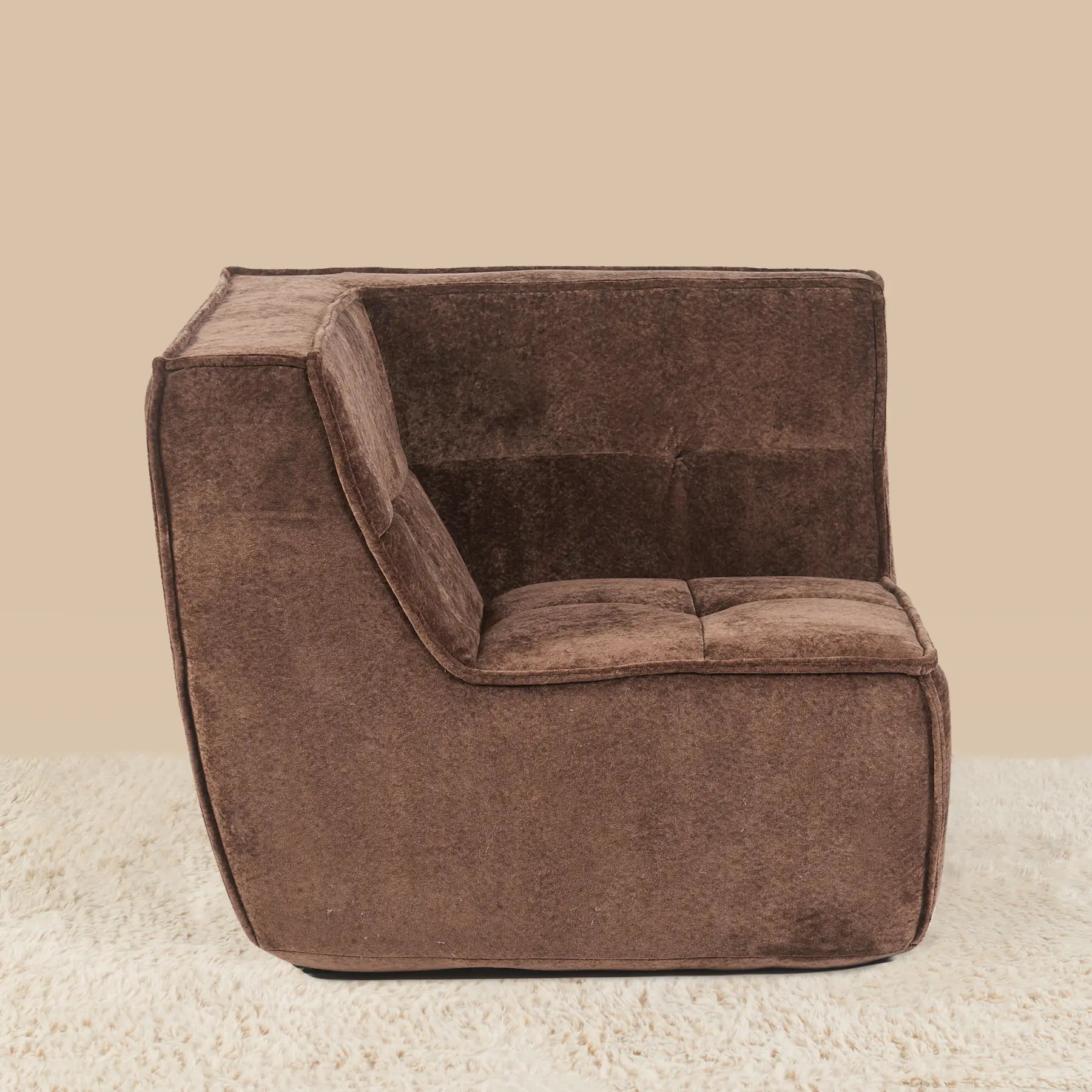 Brown corner chair on a beige carpet with a beige wall background [color: brown-snow-velvet]