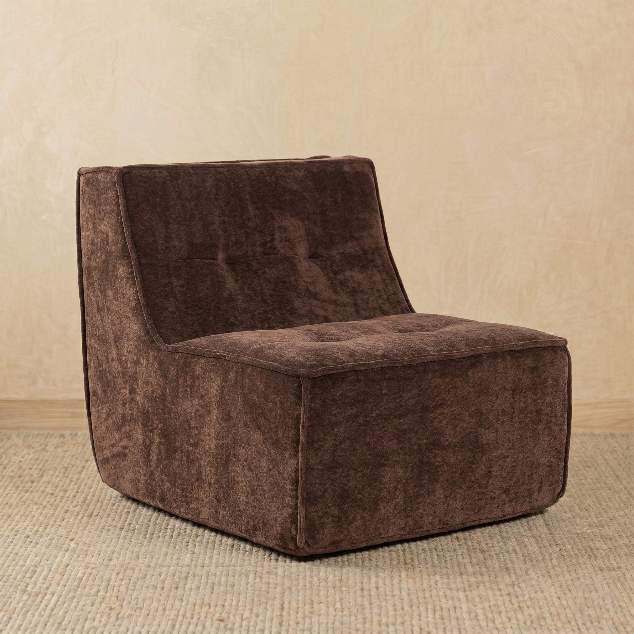 Brown textured armchair on a beige carpet with a beige wall background 
