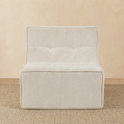 Beige upholstered chair on a beige floor with a beige wall background 