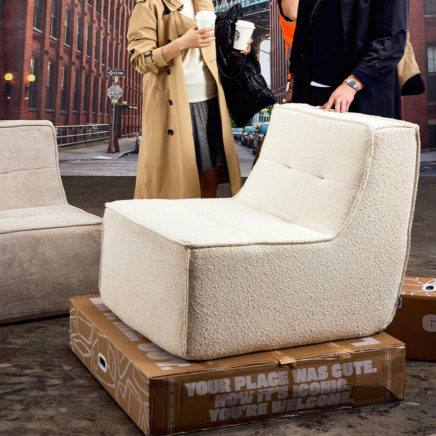 Ivory Boucle Loungi occasional chair on the streets of new york  #color_ivory-boucle