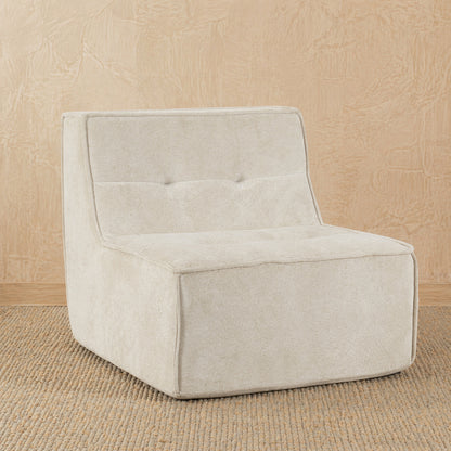 Beige upholstered chair on a beige textured background 