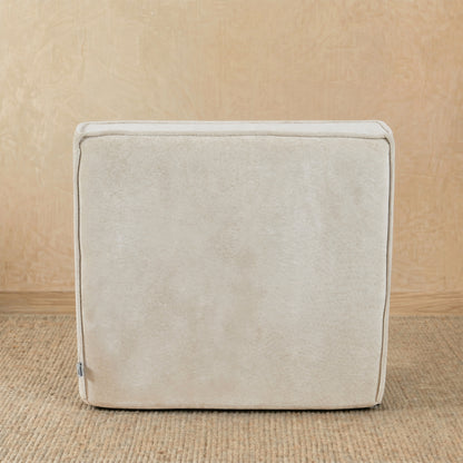 Beige fabric cube on a beige background 