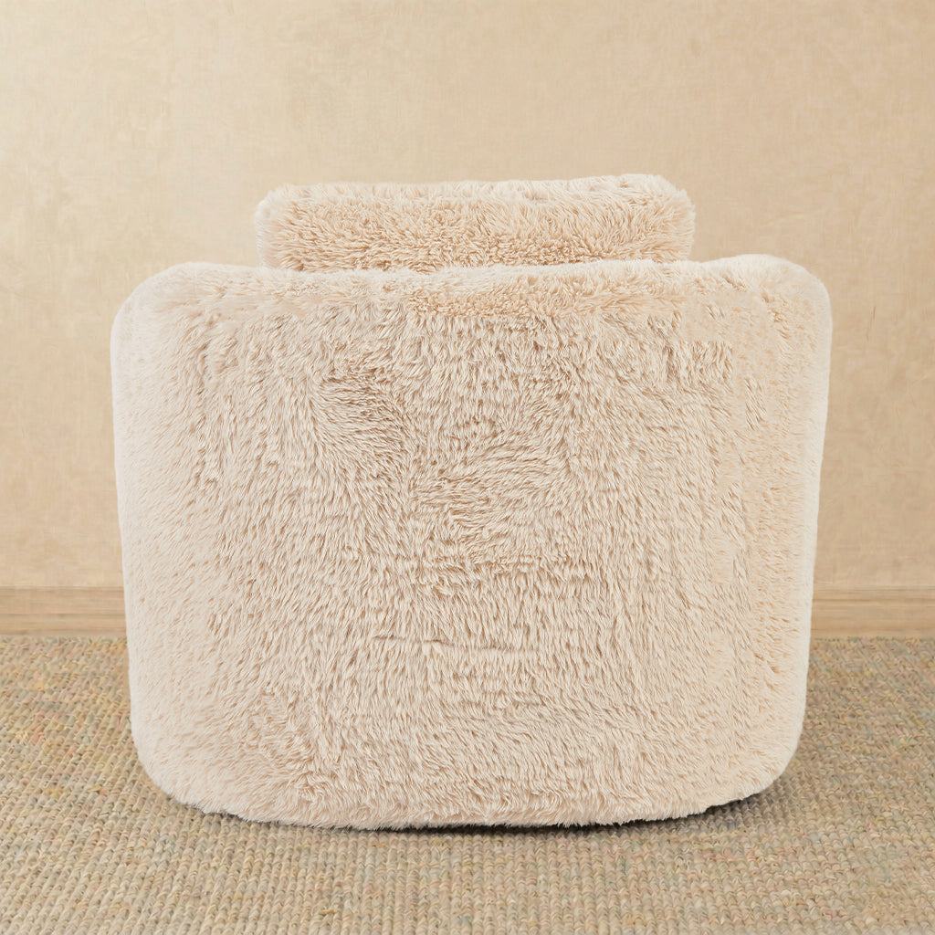 Beige fluffy ottoman on a beige background 