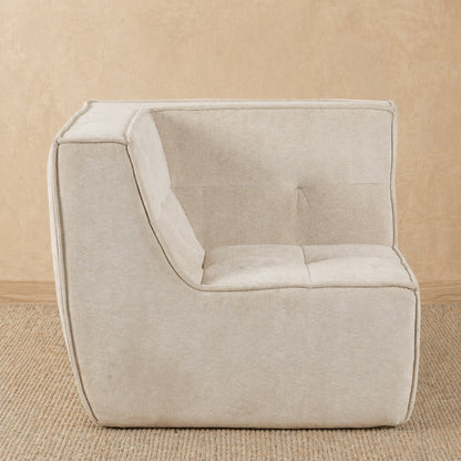 Beige armchair on a beige carpet 