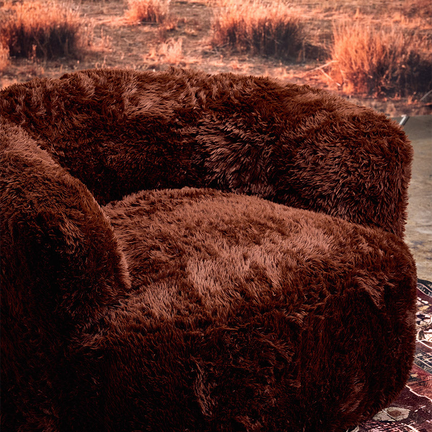 Peachi Brown Swivel Chair - Side Shot in the dessert 