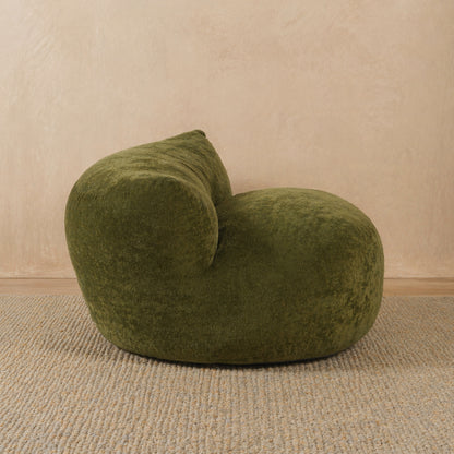 Green bean bag chair on a beige carpet with a beige wall background 