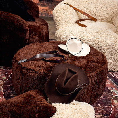 Brown round ottoman in the dessert
