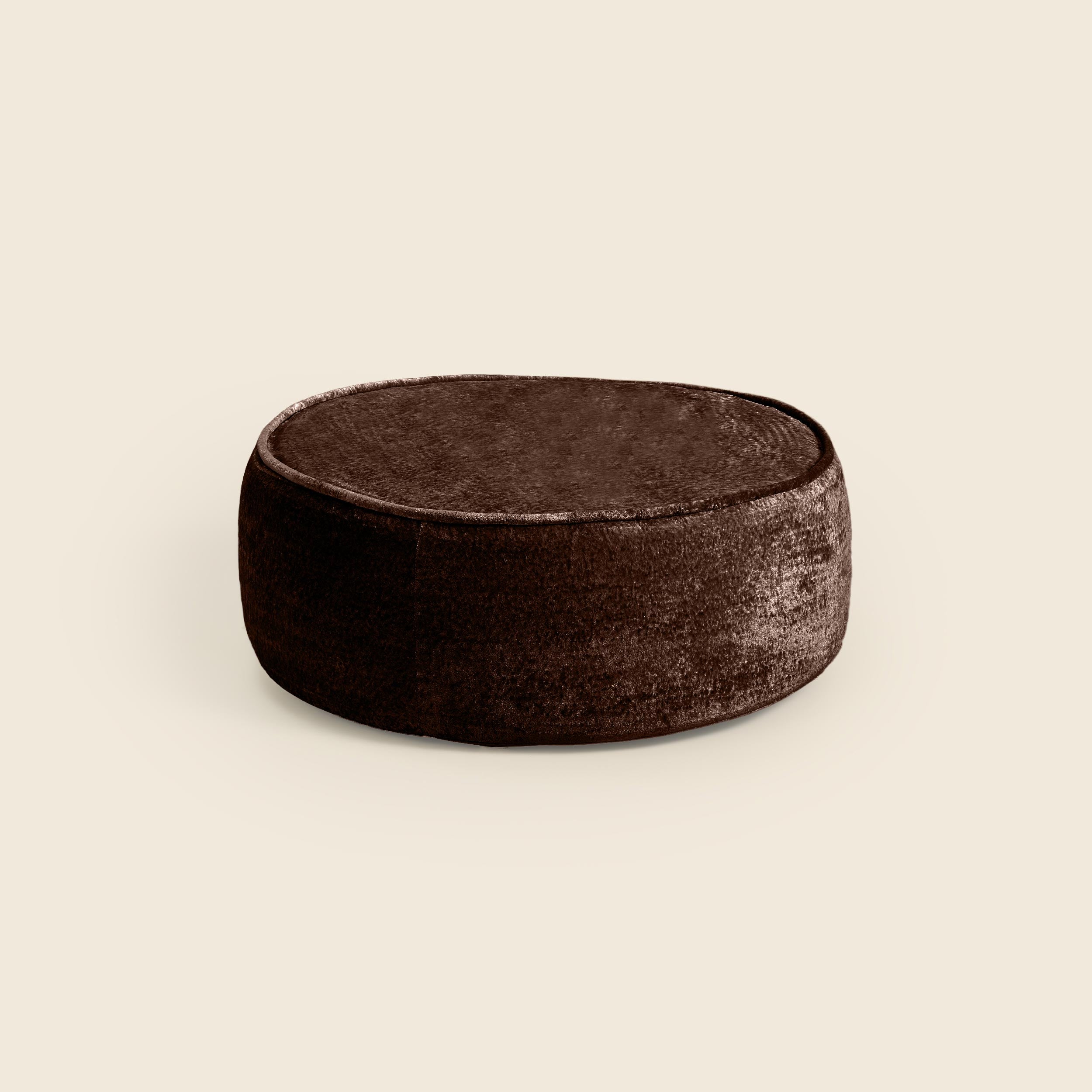 Brown ottoman on a beige background #color_brown-snow-velvet