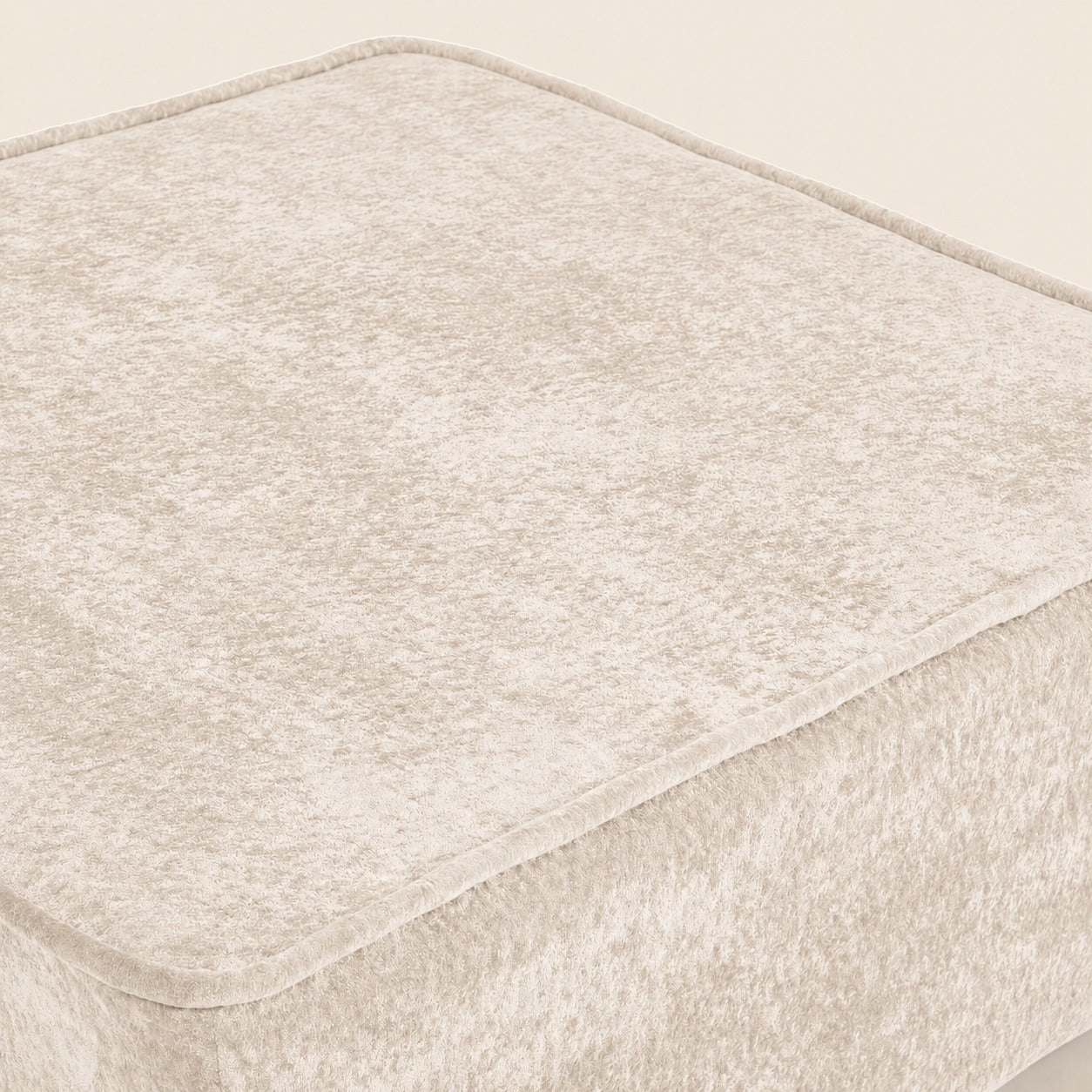 Beige textured fabric on a beige background
