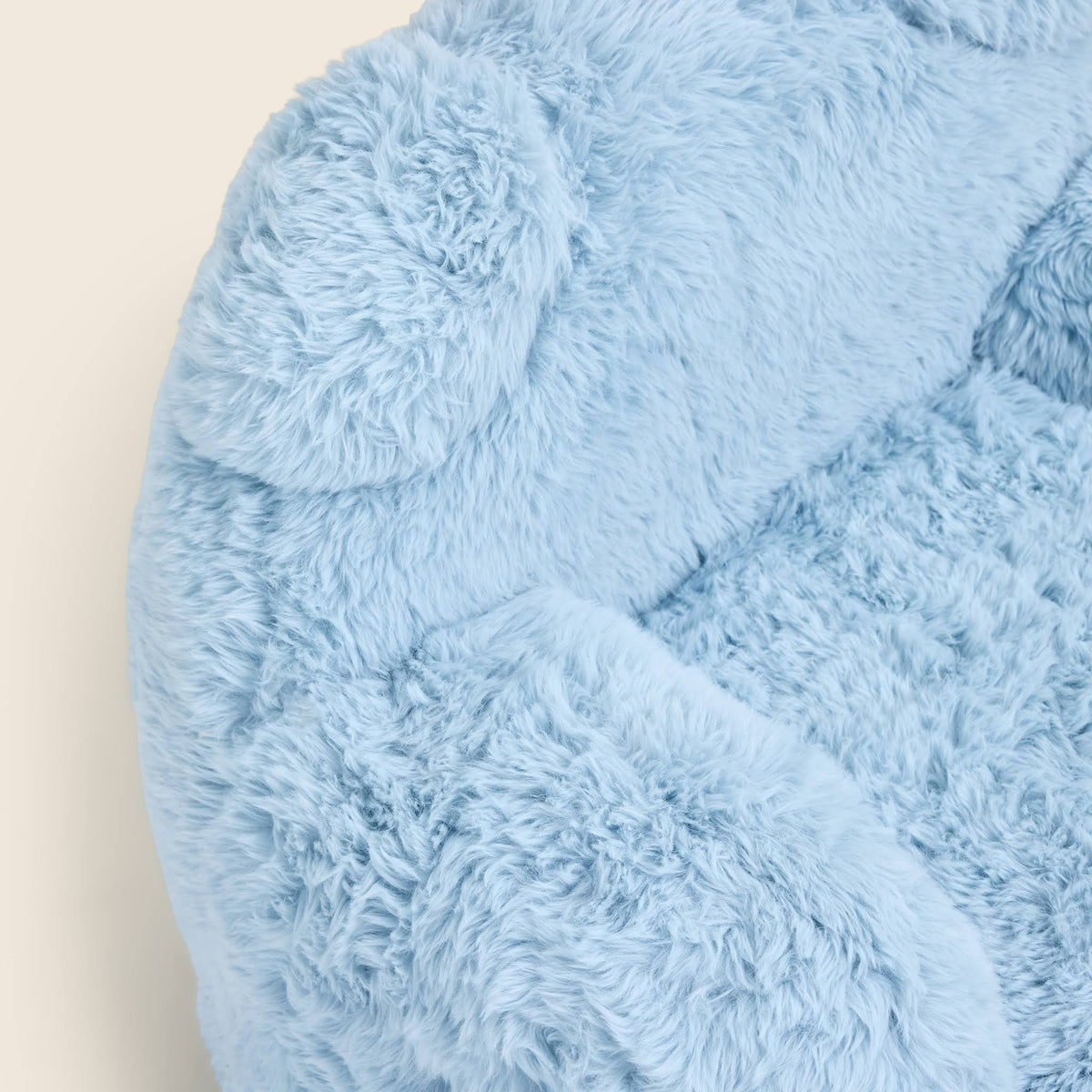Close-up of the blue Beari Kids Armchair seat, arm and ears 