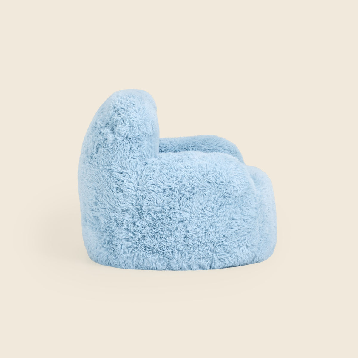 Side view of the blue Beari Kids Armchair on a beige background 
