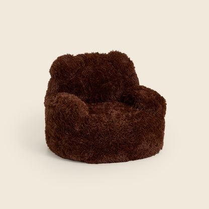 Brown Beari Kids Armchair, three-quarter front view on a beige background 