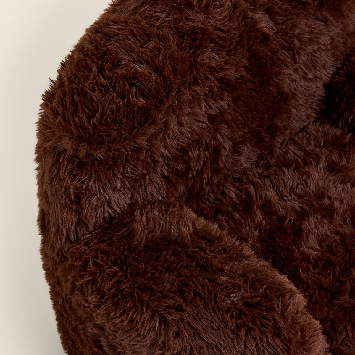 Close-up of the brown Beari Kids Armchair seat, arm and ears 
