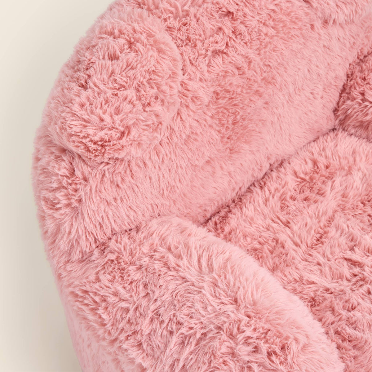 Close-up of the pink Beari Kids Armchair seat, arm and ears 