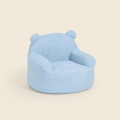 Blue Teddi Kids Armchair, three-quarter front view on a beige background 