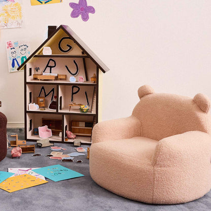 Cream Teddi Kids Armchair beside a wooden dollhouse in a playroom 