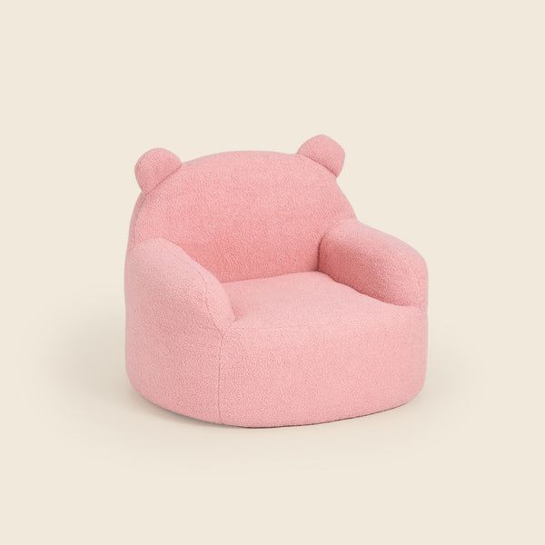 Pink Teddi Kids Armchair, three-quarter front view on a beige background #color_pink-teddy